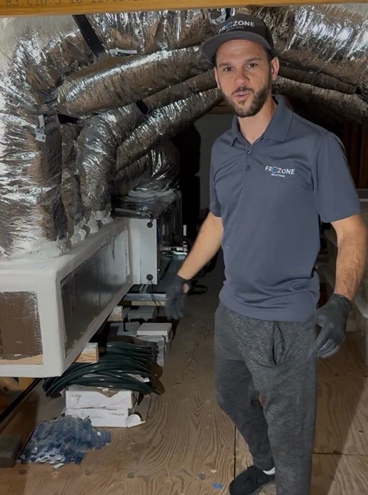 Licensed Frozone technician performing AC maintenance in Orlando FL